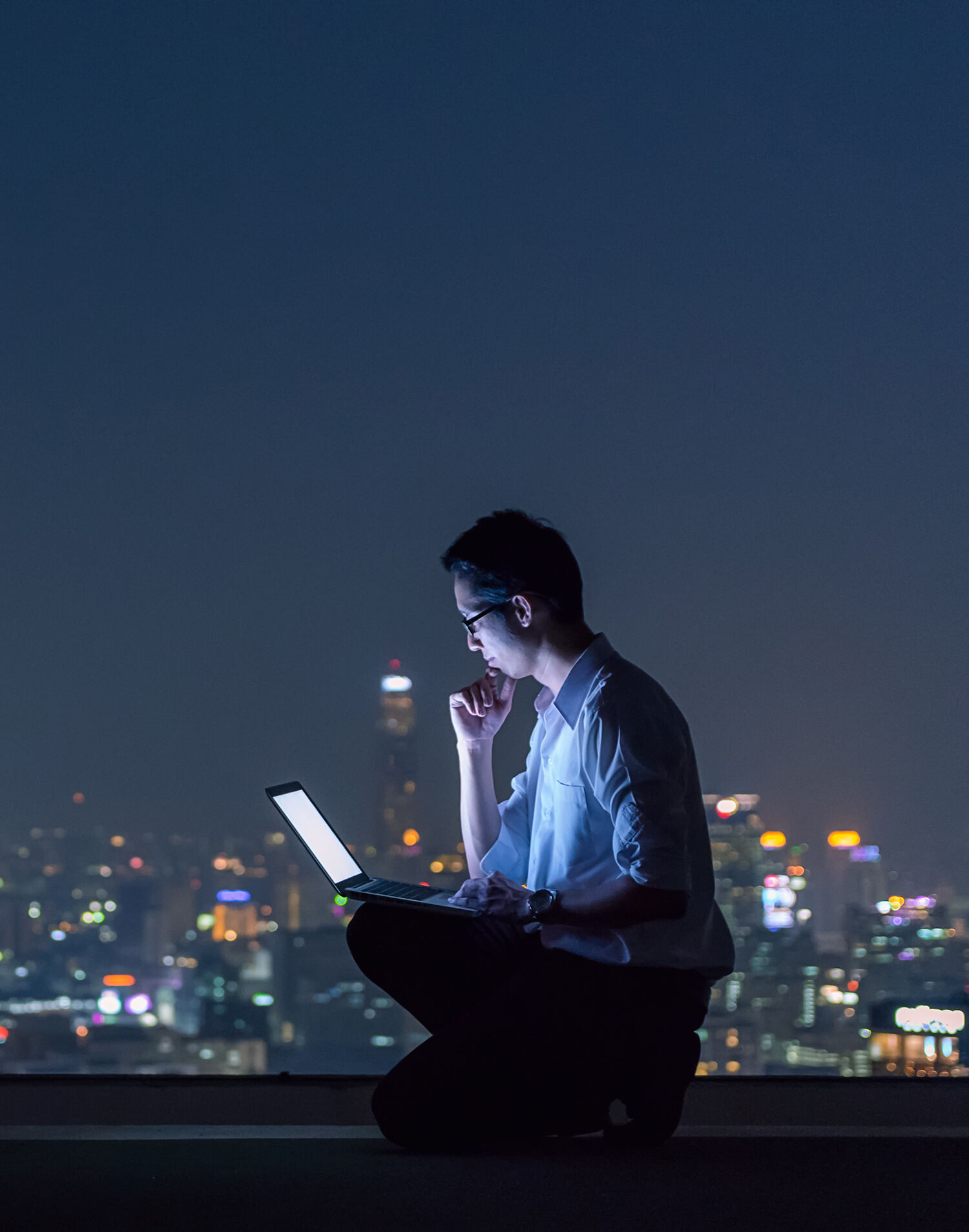 Professional working securely on a laptop in a modern office